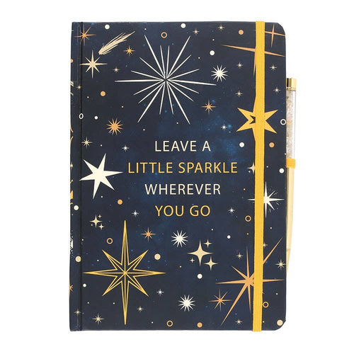 Notebook with starry design and motivational quote on a white background